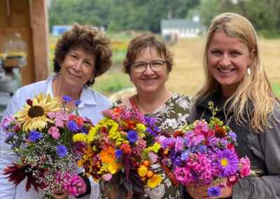 Three ladies with three u-pick flower bouquets - fresh farm grown flowers