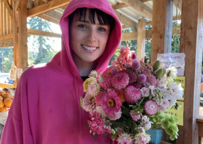 Lady in pink with her vibrant pink U-pick flower bouquet.