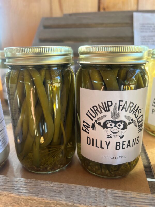 Canned dilly beans in a 16 oz jar
